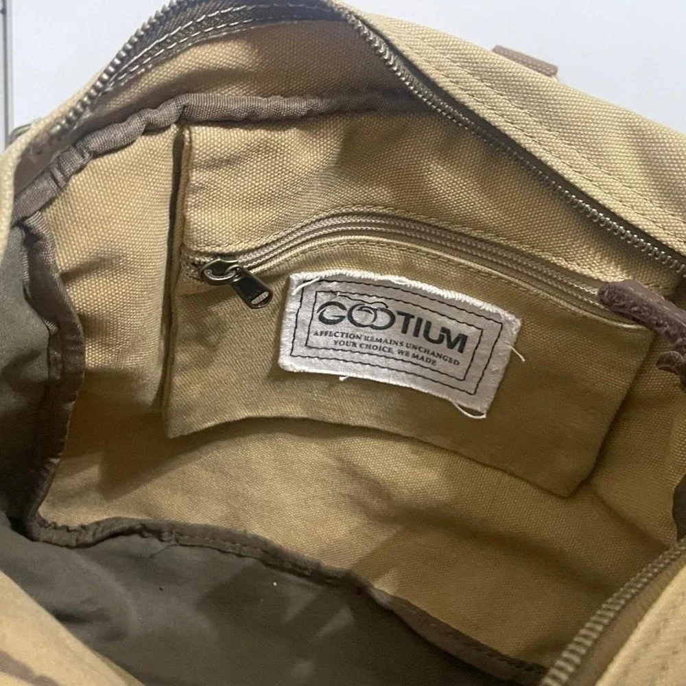 Tan canvas satchel messenger bag with adjustable strap